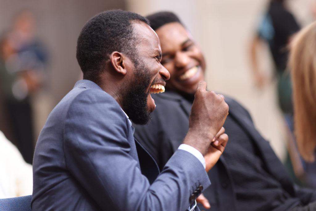 Photo of people laughing in a workshop.