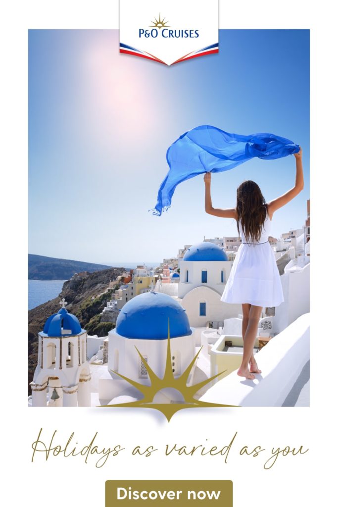 Person holding blue fabric in Greece