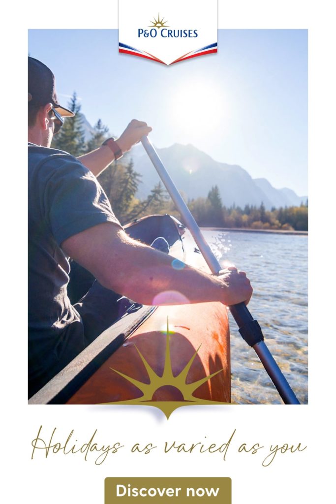 Man in kayak on sunny lake