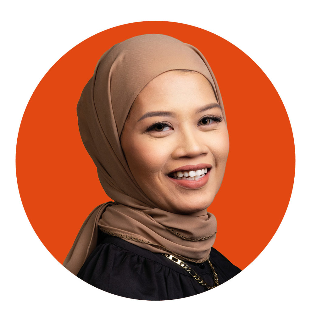 Portrait of woman cut out on orange circle background